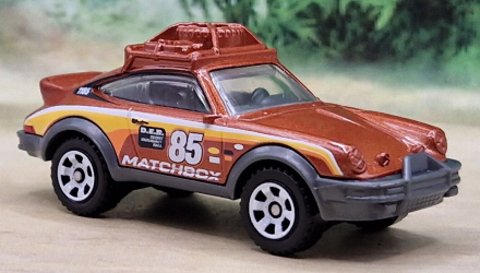 Тематическая Машинка Matchbox 1985 Porsche 911 Rally Germany 1:64 GWL49/HPC58 Brown - Retromagaz, image 2